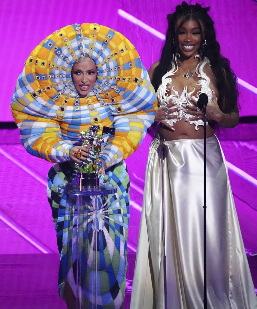 Doja Cat (L) and SZA accept